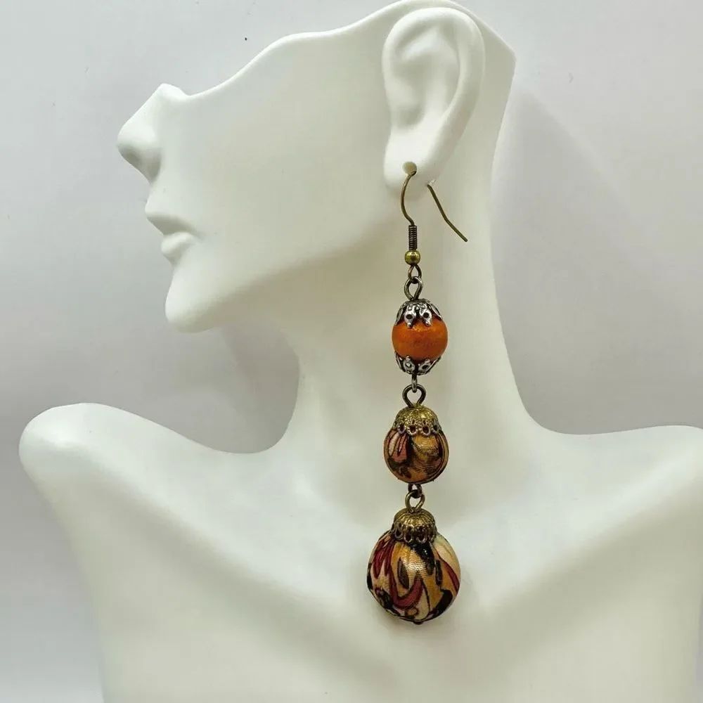 Orange and tan 3 tier ball dangling statement earrings